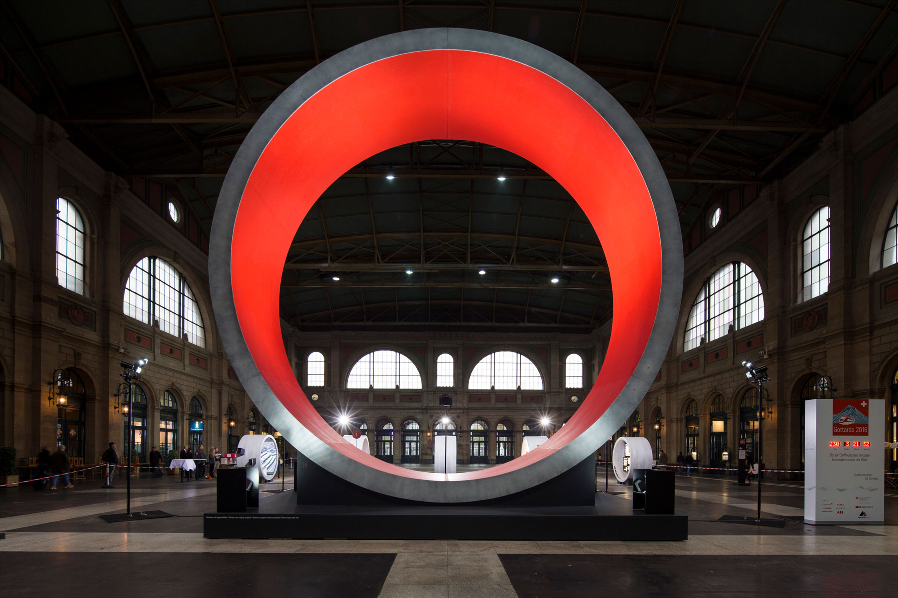 Gottardo 2016 exhibition — the illuminated red tunnel-ring installation in Zurich main station