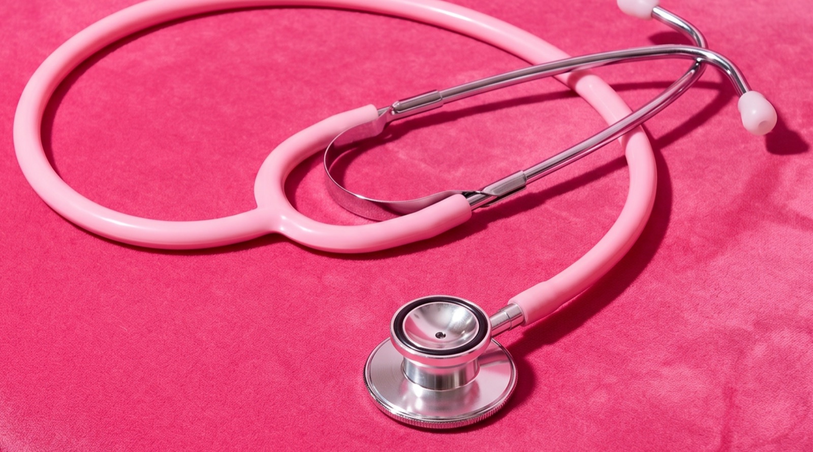 Polly lifestyle — a pink stethoscope, referencing health and family cover